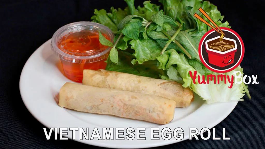 Crispy egg rolls with fresh herbs and dipping sauce